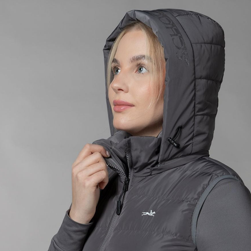 Schockemöhle Sports SPMalea Style Womens Vest - Gray aka Dusty Chocolate, shown on woman with hood up on gray background | Malvern Saddlery