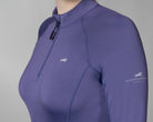 Schockemöhle Winter Page Style Shirt - Ink Blue - quarter zip ladies training layer, close up upper arm & chest on person on gray background | Malvern Saddlery