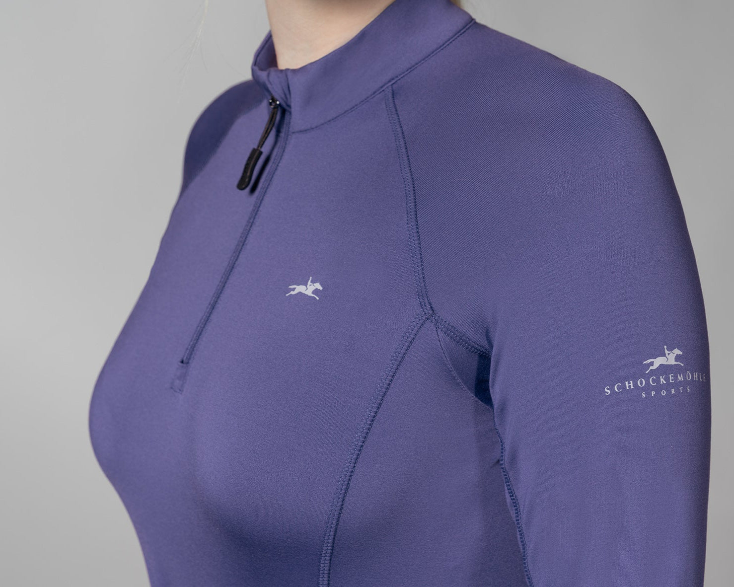 Schockemöhle Winter Page Style Shirt - Ink Blue - quarter zip ladies training layer, close up upper arm & chest on person on gray background | Malvern Saddlery