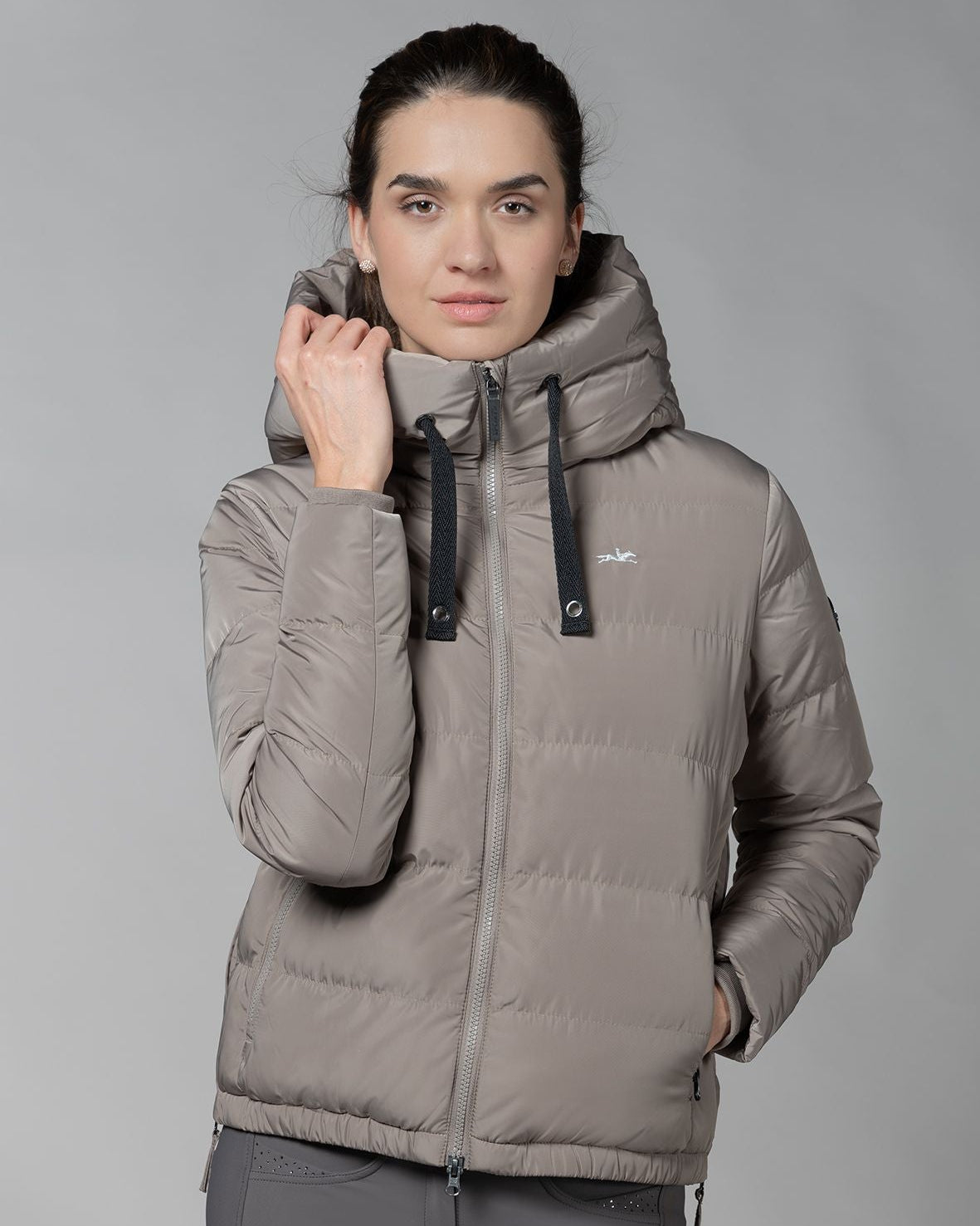 Schockemöhle Violet Puffer Jacket - Hazel; on woman on gray background | Women's Outerwear | Malvern Saddlery