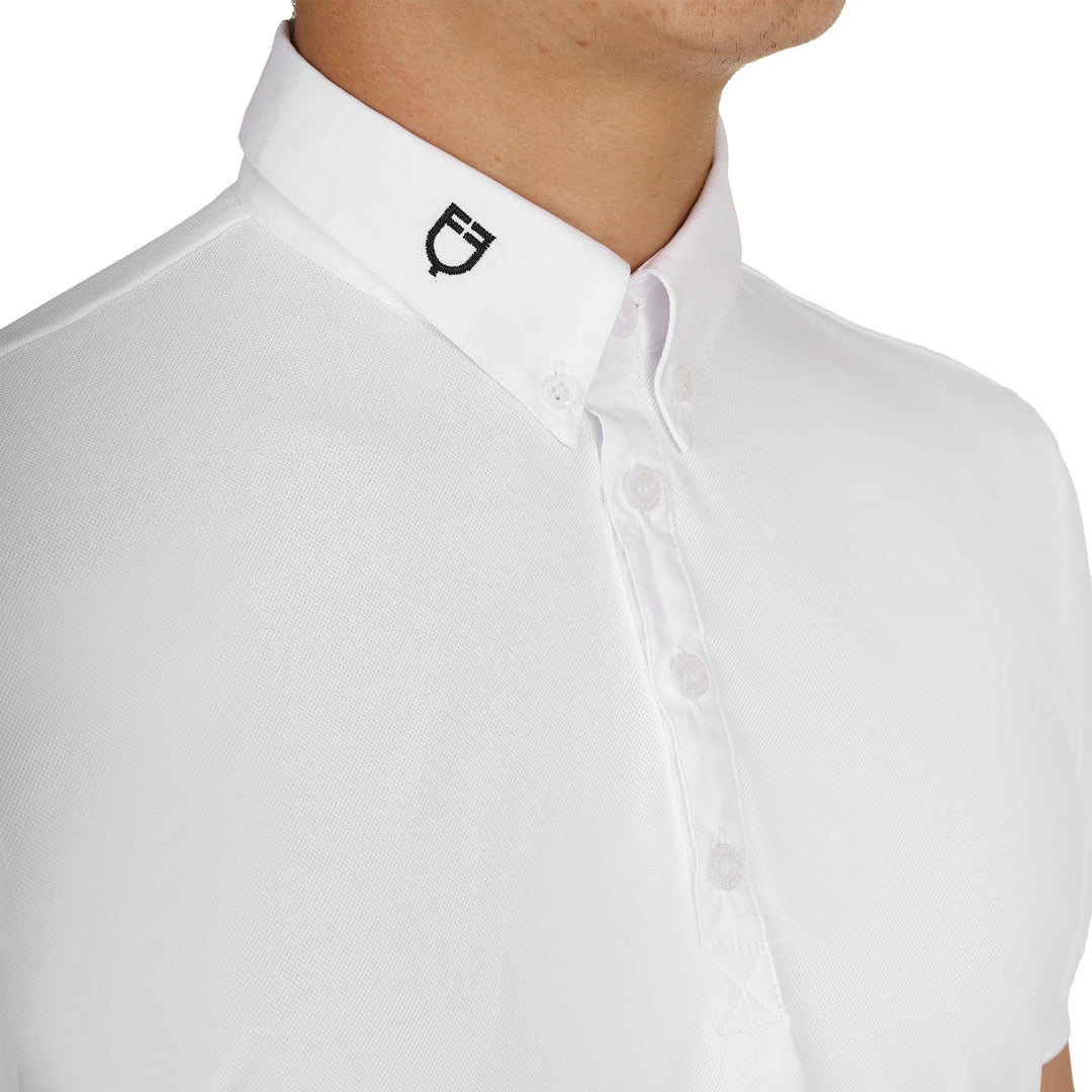 Equestro Men's Competition Polo Shirt in breathable technical fabric - White; chest/colloar detail shown on man on white background | Men's Equestrian Show Shirts | Malvern Saddlery
