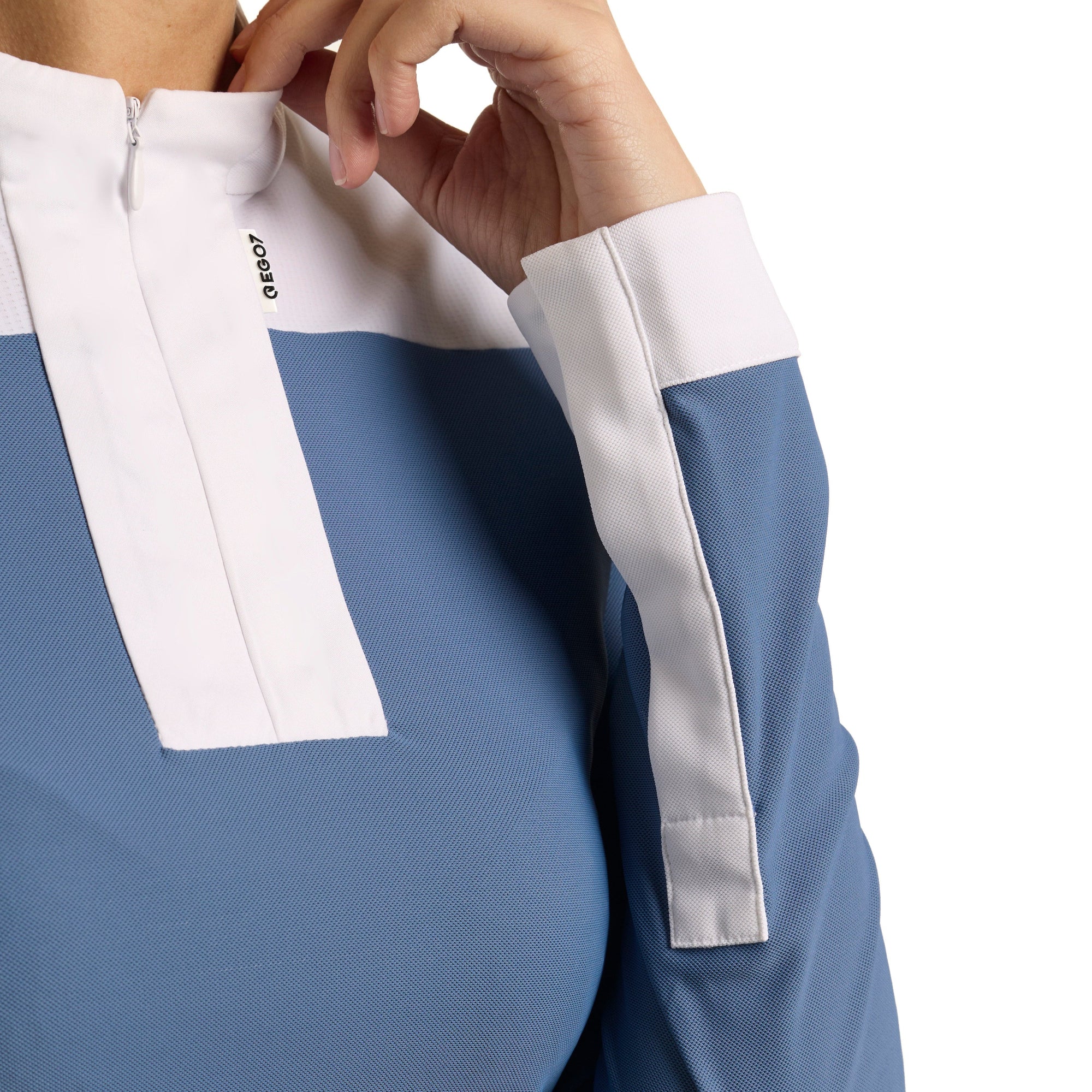 Close-up of the EGO7 Carmen Colony Blue competition shirt cuff and contrast placket
