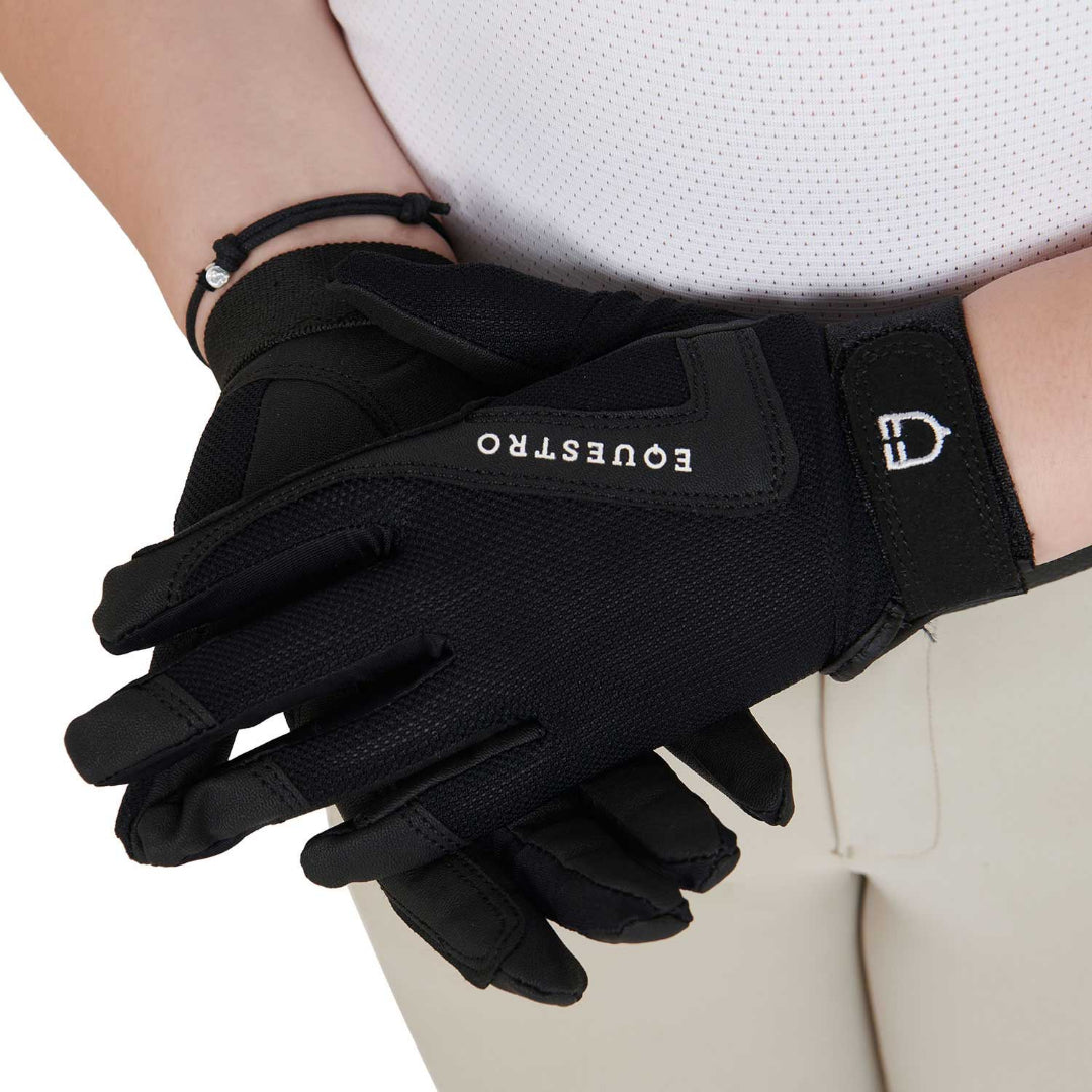 Equestro Young Rider Technical Gloves - Black; close up shown on model hands wearing riding apparel on white background | Children's Riding Accessories | Malvern Saddlery