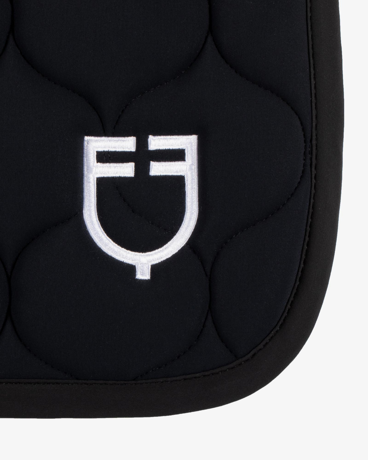 Equestro Circular Quilt Jump Saddle Pad; rear side logo detail | Malvern Saddlery