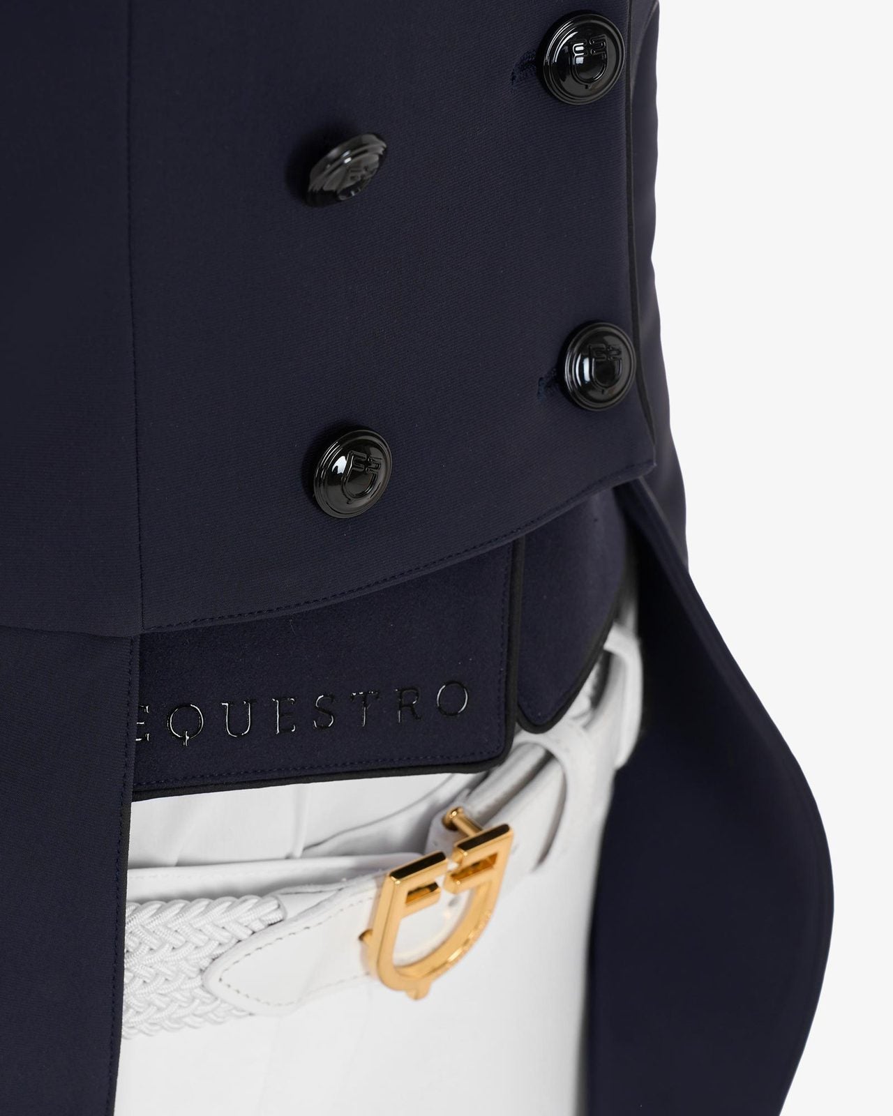 Equestro Women's Competition Dressage Shadbelly - Navy Blazer; detail tail flaps shown on woman on white background | Equestrian Show Coats | Malvern Saddlery