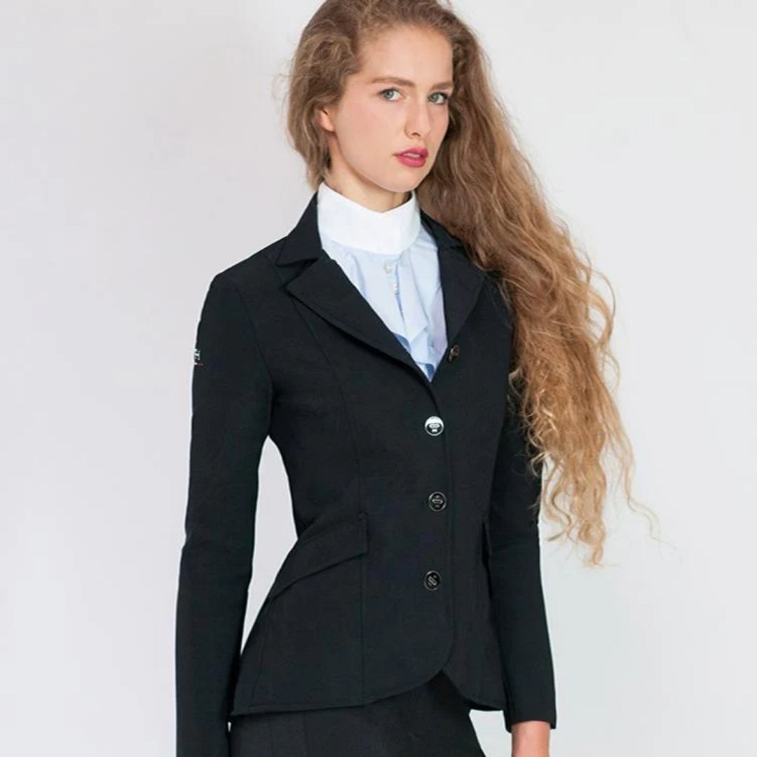 For Horses YAKIE Show Jacket - Black | Competition Riding Apparel; shown on woman on gray background | Malvern Saddlery