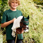 LeMieux Hobby Horse Grackle Bridle, shown with kid on Flash | Malvern Saddlery