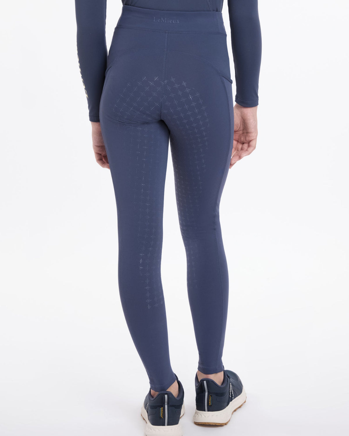 LeMieux Young Rider Orla Pull Ons - Dusk Blue, shown on model on white background | Malvern Saddlery