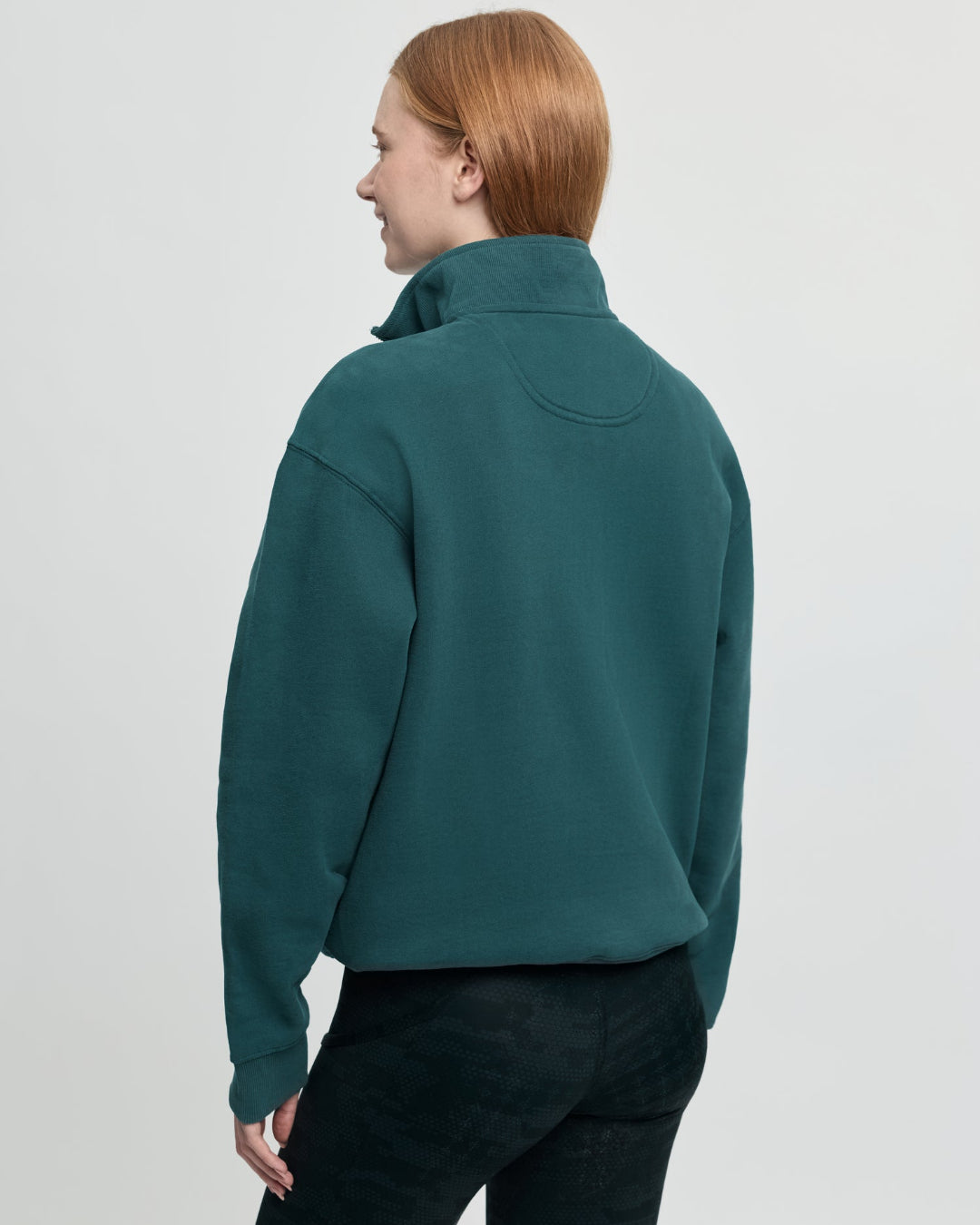 LeMieux Kelsie Quarter Neck Sweatshirt - Jungle Green; back view, shown on person against gray background | Malvern Saddlery