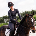 TKEQ Kennedy Seamless 2.0 Long Sleeve Performance Shirt - Black Camo,  shown on rider sitting on chestnut horse| Malvern Saddlery