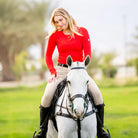 TKEQ Kennedy Seamless 2.0 Long Sleeve Performance Shirt - Rouge Red,  shown on rider sitting on white horse | Malvern Saddlery