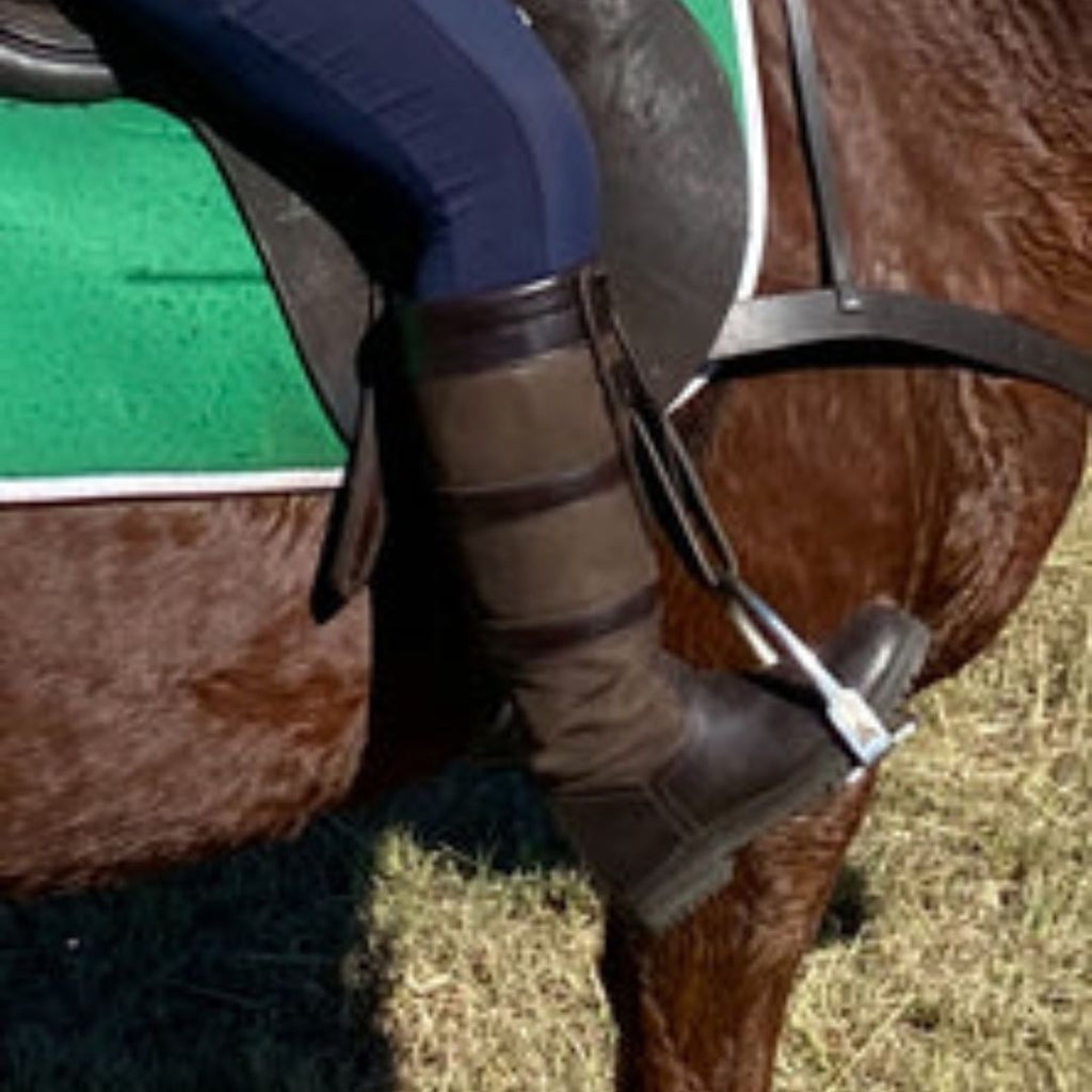 Outback Survival Gear - Town & Country Boots - Short, shown on rider foot in stirrup | Malvern Saddlery