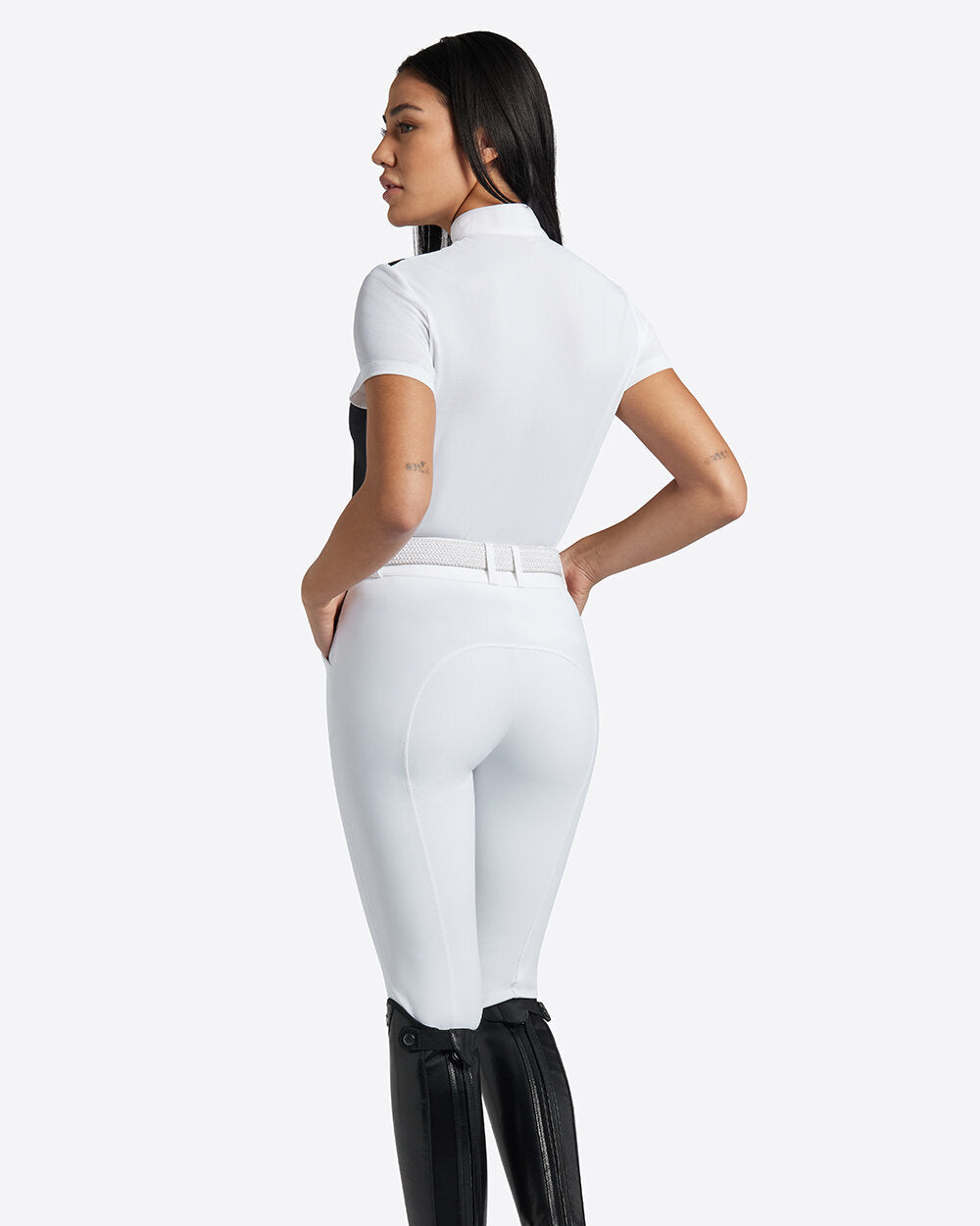 Rider's Gene Ladies Competition Polo - Navy/White, back view on model | Malvern Saddlery