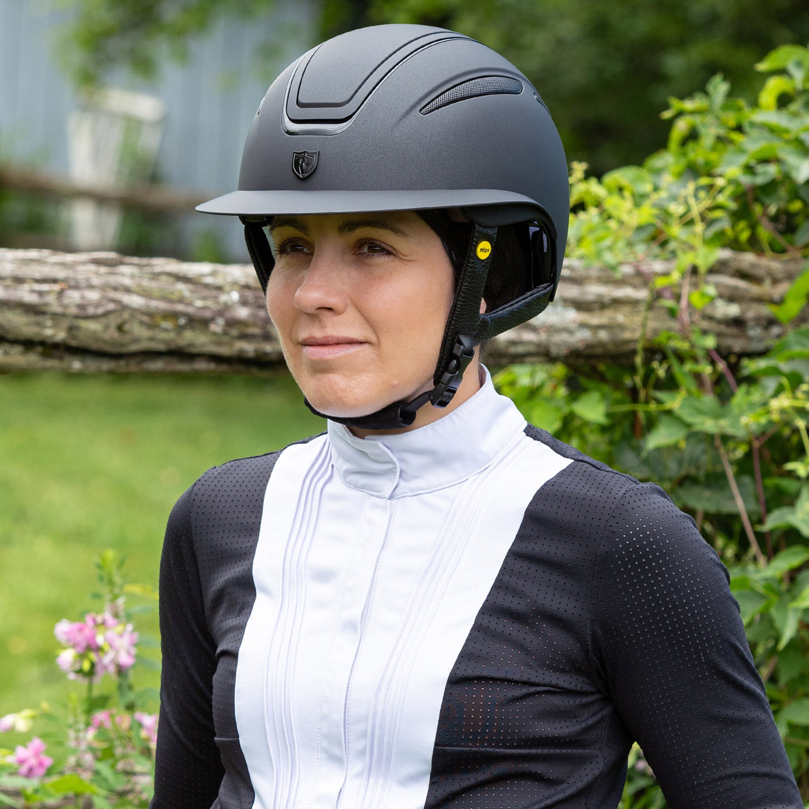 Tipperary Oxford Shimmer MIPS® Wide Brim Helmet - Black with Matte/Gloss trim; shown on rider outdoors | Equestrian Helmets | Malvern Saddlery