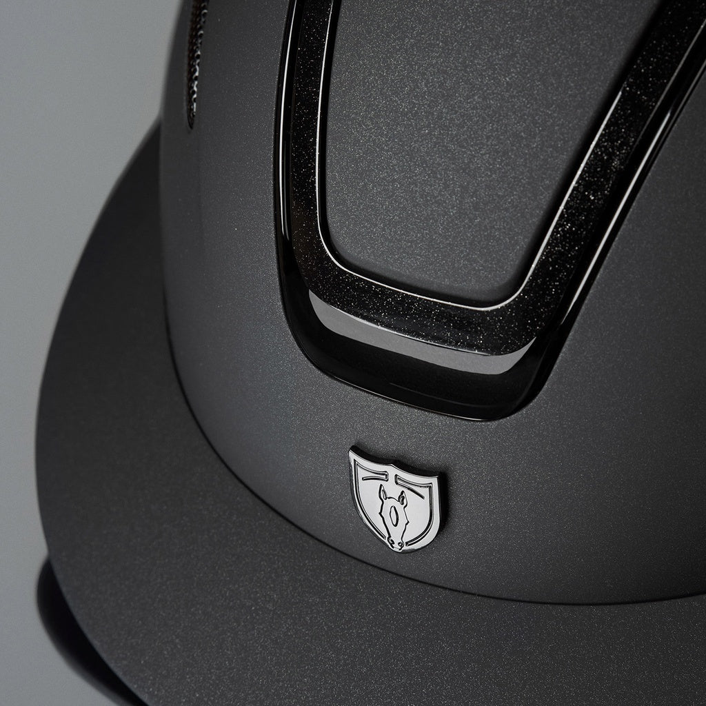 Tipperary Oxford Shimmer MIPS® Wide Brim Helmet - Black with Glimmer/Gloss trim; close up brim, front trim | Equestrian Helmets | Malvern Saddlery