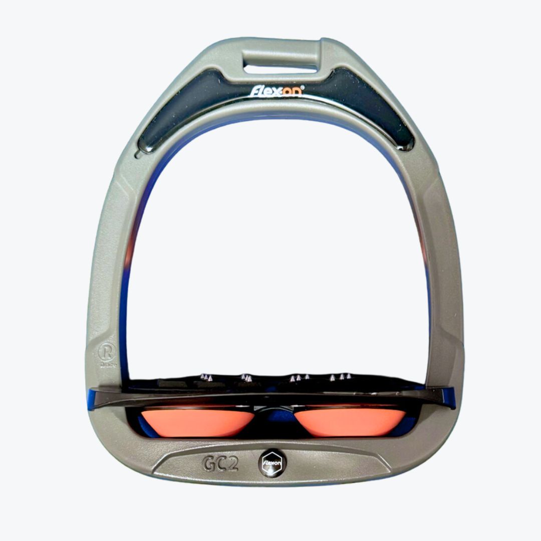 Flex-On GC2 composite stirrup with a black magnet featuring the Flex-on logo, a black footbed, and orange shock absorber  | Tack Shop | Malvern Saddlery