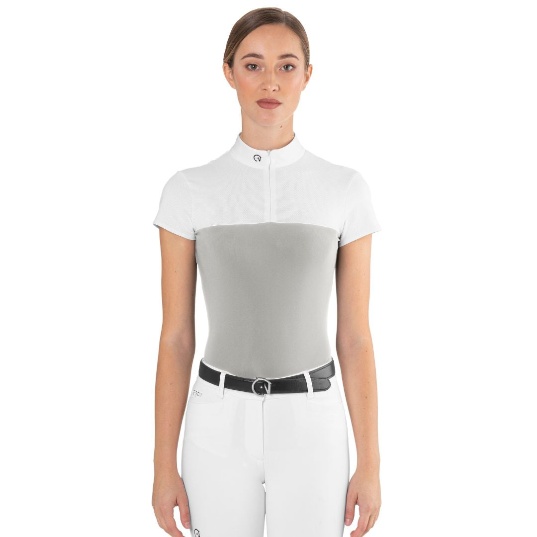 Front view of a female rider wearing the ice grey EGO7 Mesh Women's Short Sleeve Show Shirt with white mesh shoulders and stand-up collar.