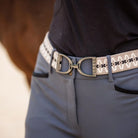 Ellany Stirrup Elastic Belt - 1.5" - Harlow pattern, gunmetal buckle waist detail shown on woman wearing gray breeches | Malvern Saddlery