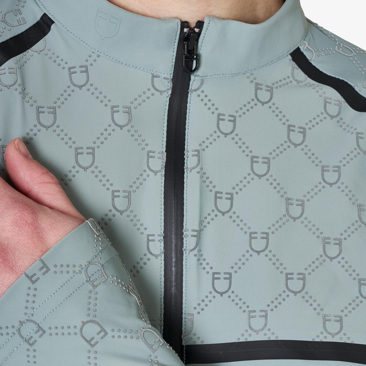 Equestro Women's Monogram Long Sleeve Training Polo in Slate Grey zip and monogram close up