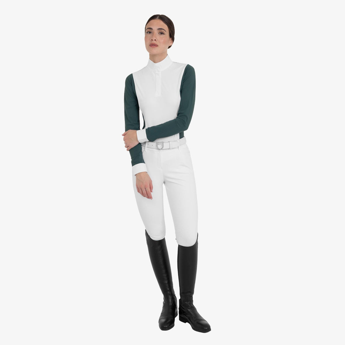 Equestro Women's Perforated Long Sleeve Competition Polo in Pine Grove worn with breeches and tall boots