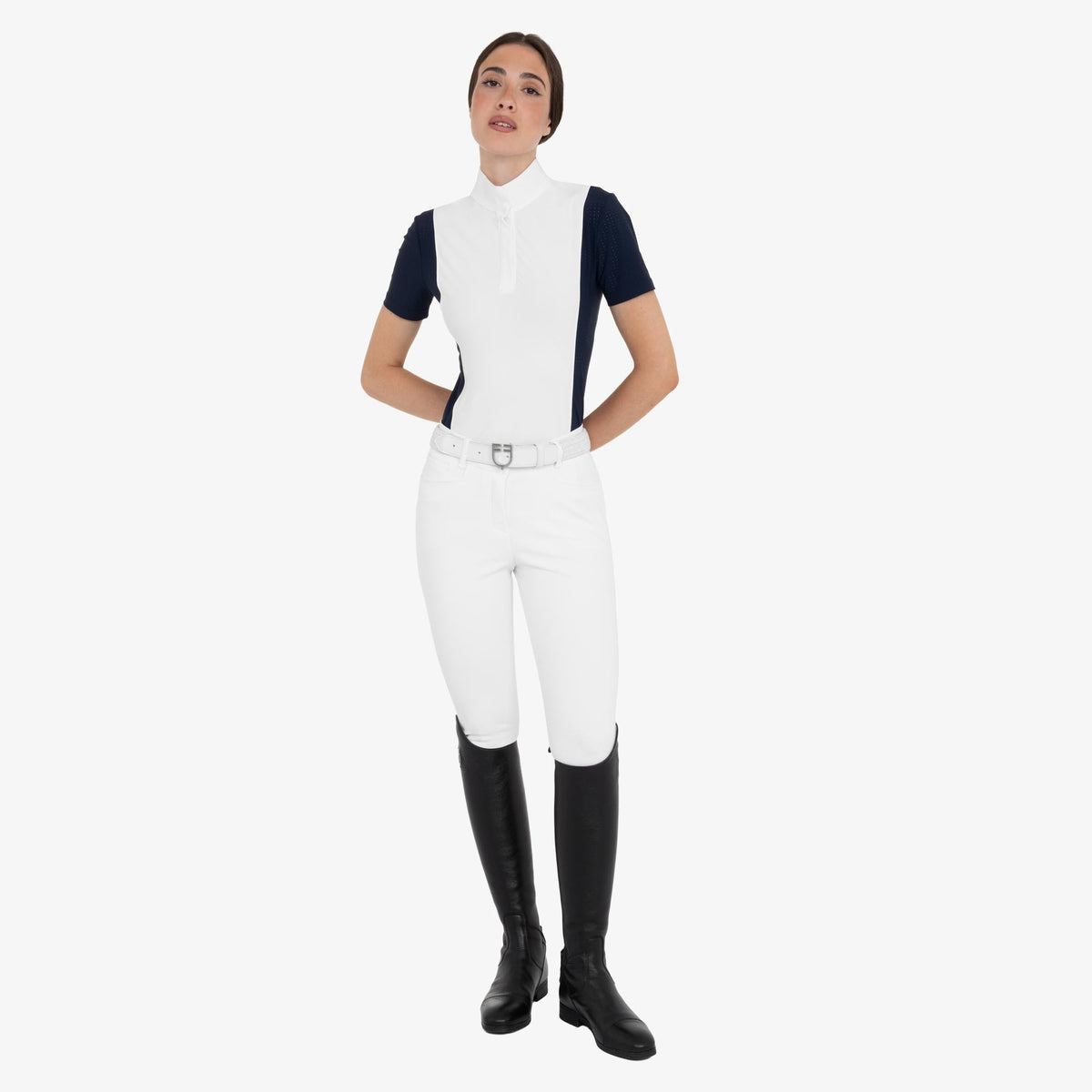 Equestro Women's Perforated Short Sleeve Competition Polo in Navy Blazer worn with breeches and tall boots
