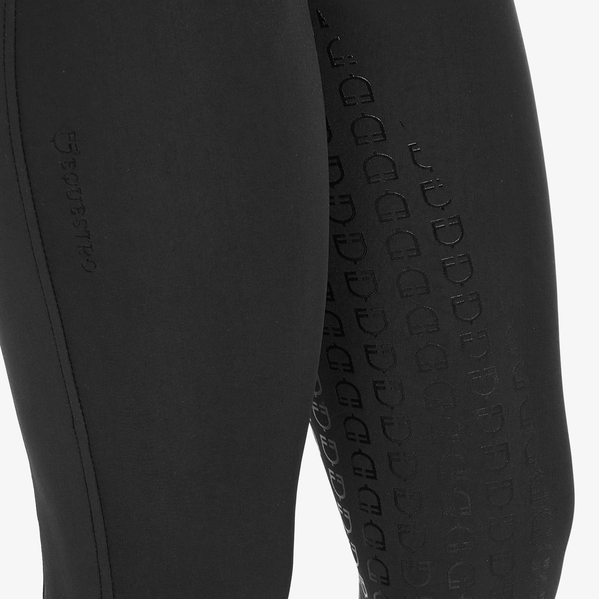 Equestro Women's Fleece-Lined Full Grip Breeches - Black, silicone logo grip close-up | Malvern Saddlery