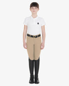 Equestro Girls Slim Fit Competition Breeches - Tan, shown on girl with belt, boots & shirt | Young Rider Apparel | Malvern Saddlery