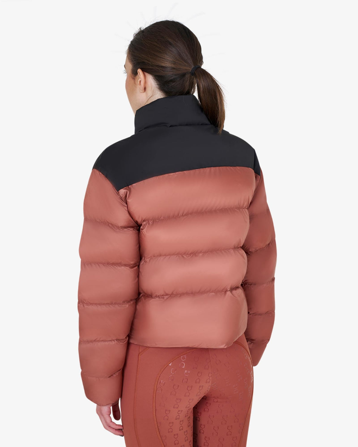 Equestro Cropped Puffer Jacket - Redwood & Black; back view shown on woman on white background | Ladies Outerwear | Malvern Saddlery