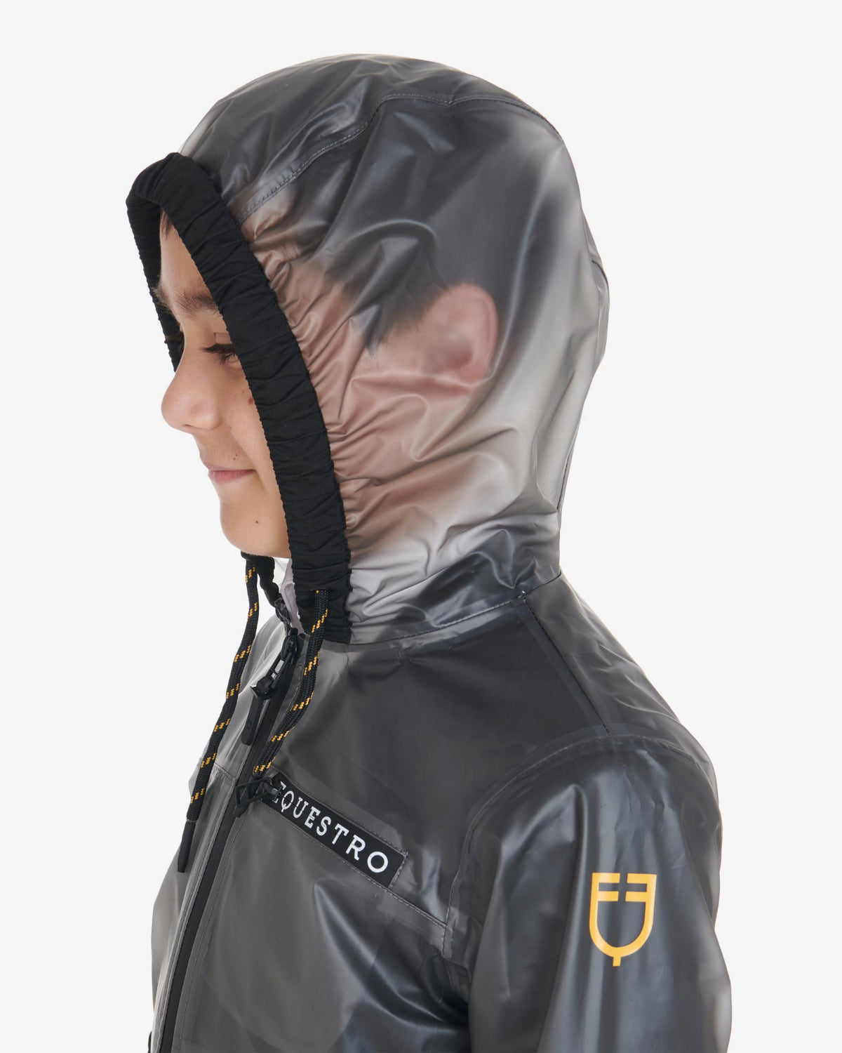 Equestro Young Rider Unisex Raincoat - close up view shown on boy with hood up  | Children's Riding Apparel | Malvern Saddlery