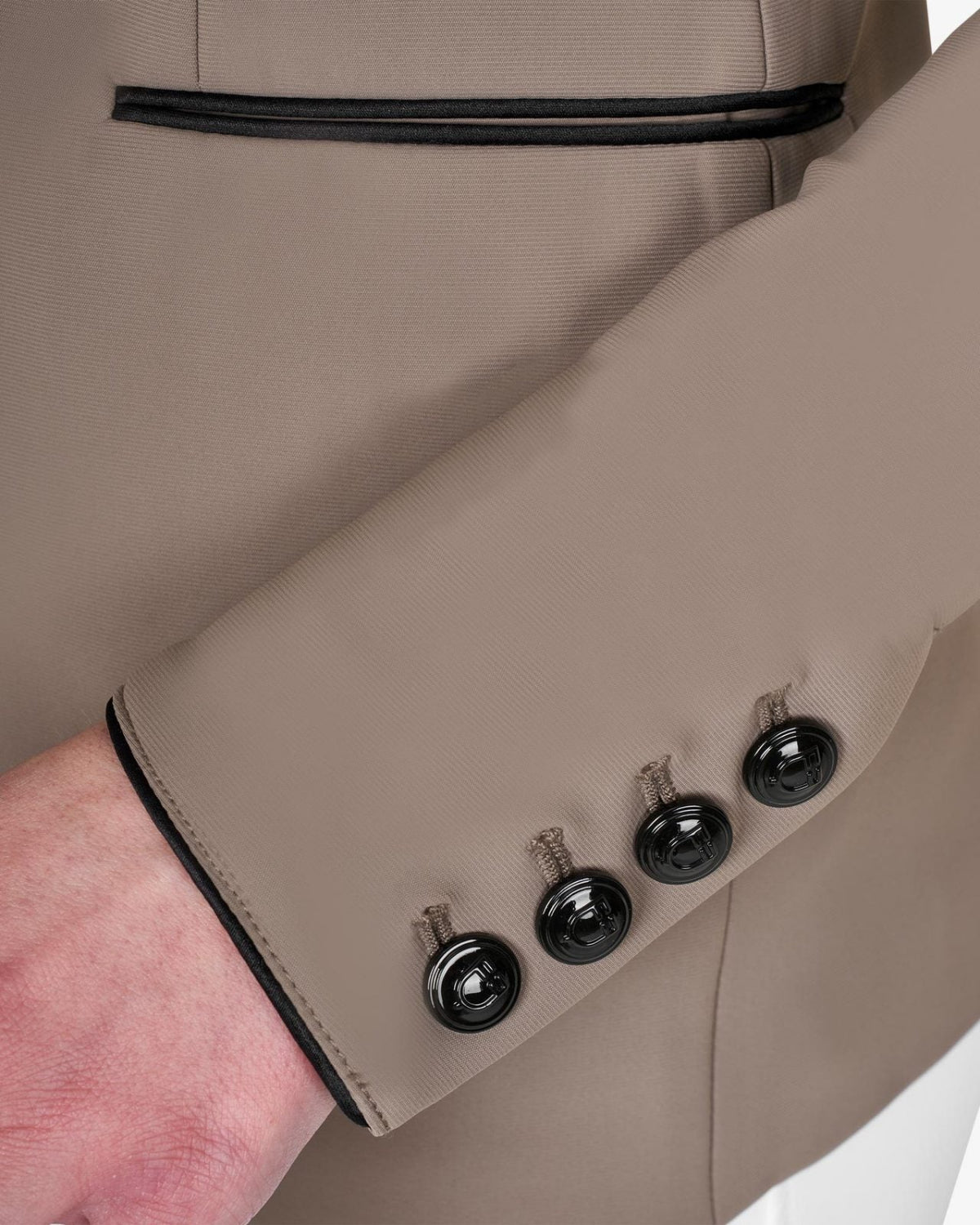 Equestro Women's Elegance Show Coat - Walnut; sleeve/button detail, shown on woman wearing matching helmet | Equestrian Competition Apparel | Malvern Saddlery