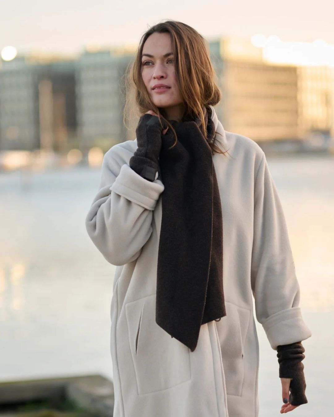 Woman wearing Luxe Fleece Wrist Warmers, Triangle Scarf & Cardigan Malvern Saddlery