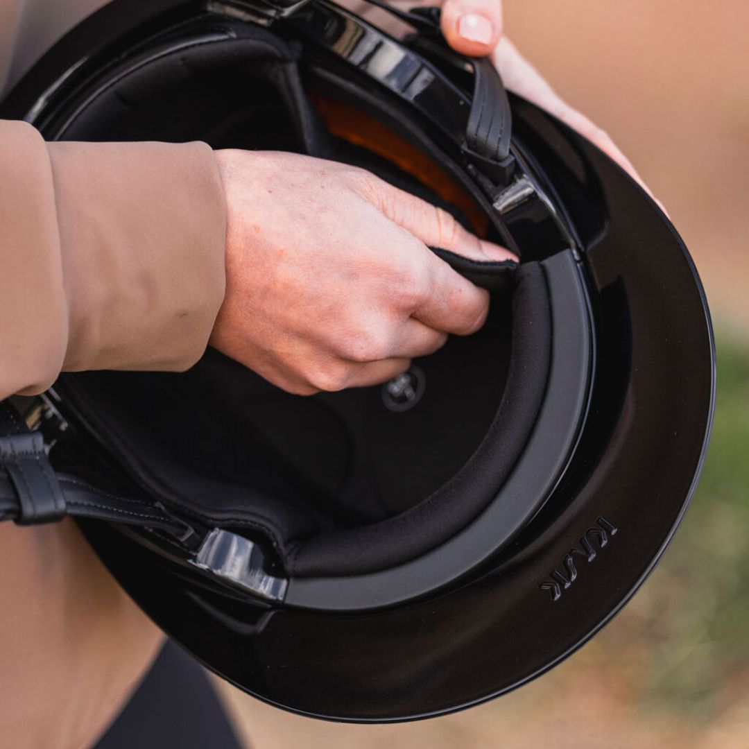 KASK Equestrian Helmet Inner Padding - fits Kooki & Kooki Lady Models; close up shown in helmet with persons hands removing from shell | Rider Accessories | Malvern Saddlery