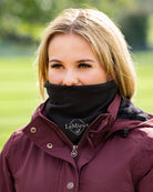 LeMieux Stretch Neck Scarf Snood - Black, lifestyle image shown on woman wearing maroon coat | Malvern Saddlery