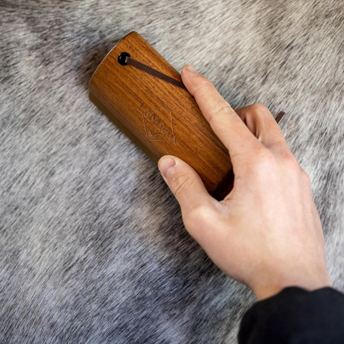 LeMieux Artisan Shedding Comb; shown with hand combing gray horse | Horse Grooming | Malvern Saddlery