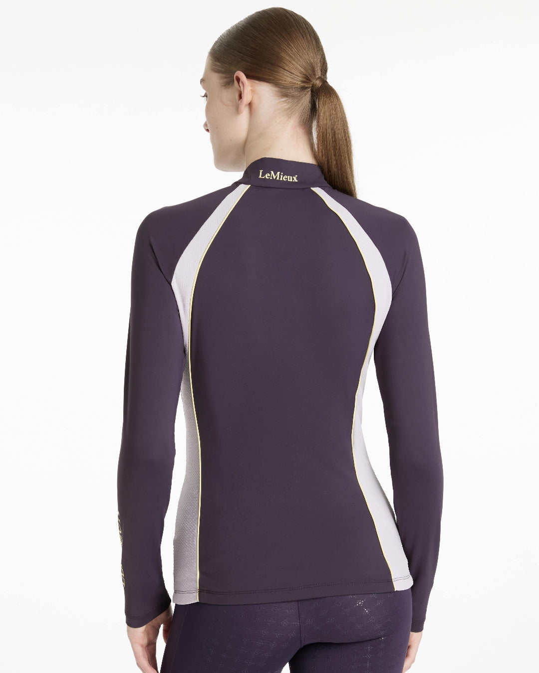 LeMieux Philippa Mesh Ladies Base Layer Top - Juniper Purple, shown on woman, back view | Athletic Wear | Malvern Saddlery