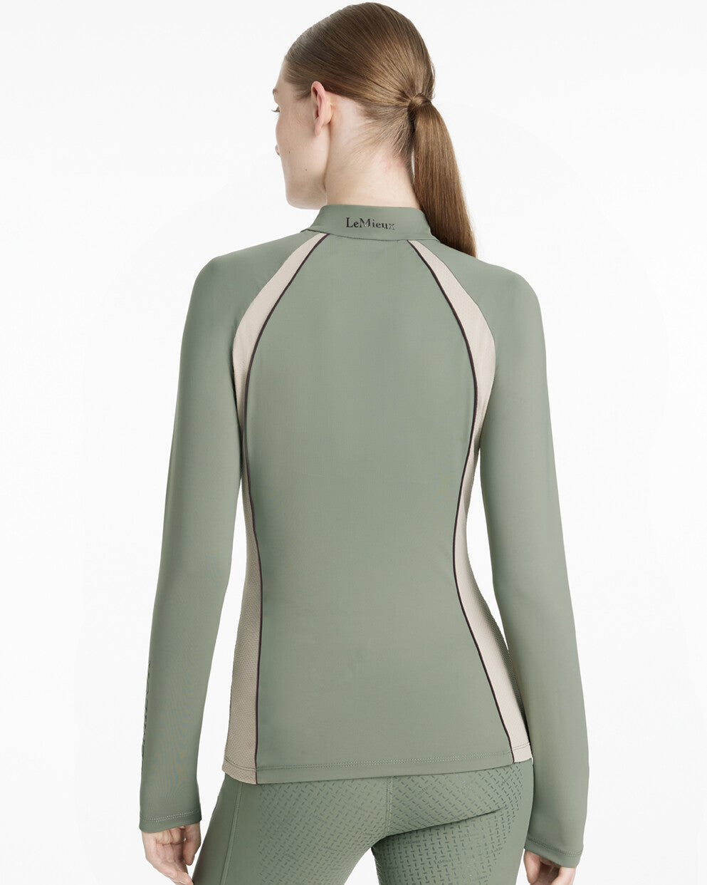LeMieux Philippa Mesh Ladies Base Layer Top - Rosemary Green, shown on woman - back view | Athletic Wear | Malvern Saddlery