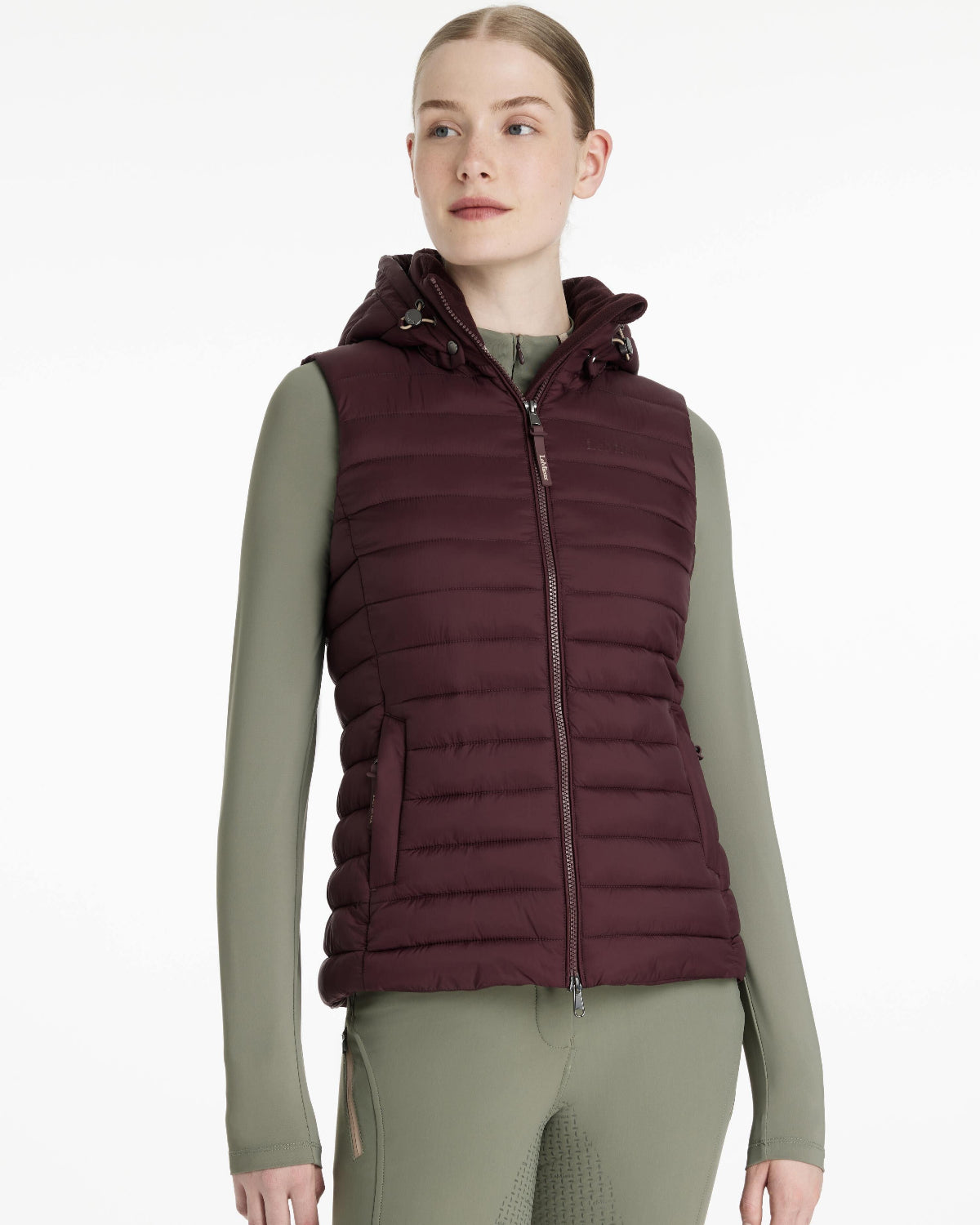LeMieux Rose Hooded Puffer Vest - Damson Maroon, shown on woman on white background| Malvern Saddlery