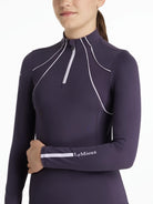 LeMieux Young Rider Mia Mesh Base Layer - Juniper Purple, shown on model on white background | Malvern Saddlery