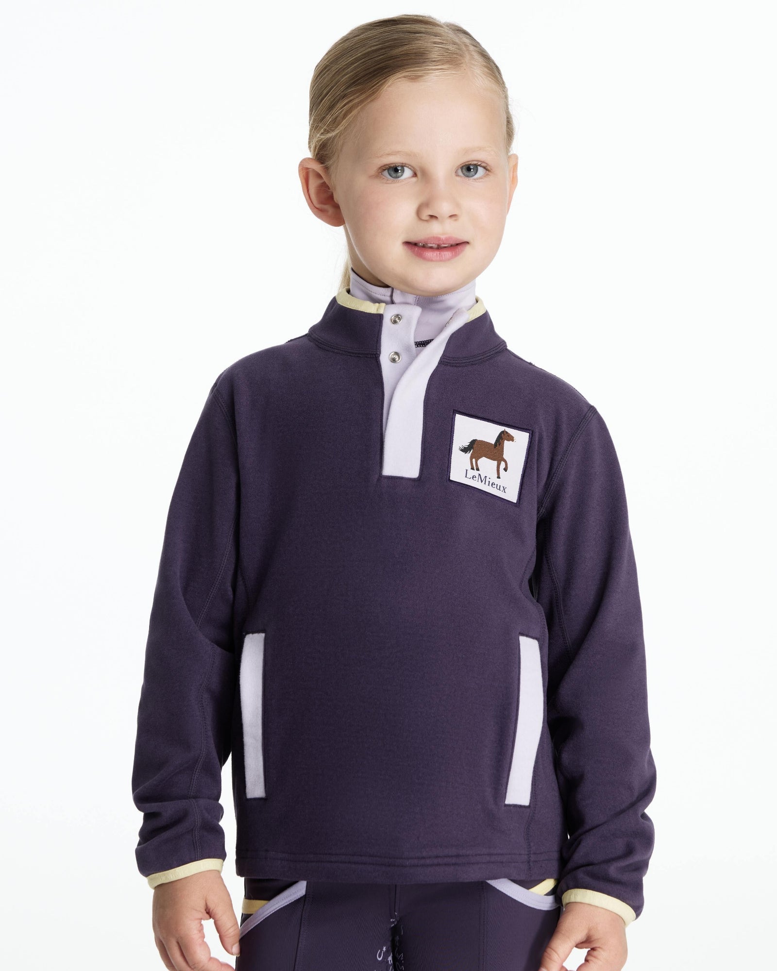LeMieux Mini Mae Popper Fleece - Juniper Purple Pullover - shown on young girl on white background | Children's Activewear | Malvern Saddlery