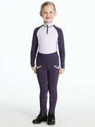 LeMieux Mini Base Layer Top - Lilac, shown on young girl wearing juniper purple riding pants| Children's Riding Apparel | Malvern Saddlery