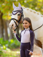LeMieux Mini Base Layer Top - Lilac, shown on young girl standing with horse | Children's Riding Apparel | Malvern Saddlery