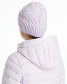 LeMieux Bodie Beanie - Lilac, back view shown on person wearing light purple coat on white background | Winter Hats | Malvern Saddlery