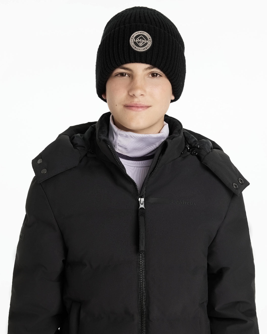 LeMieux Bodie Beanie - Black, shown on person wearing black coat on white background | Winter Hats | Malvern Saddlery