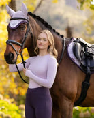LeMieux Britney Seamless Long Sleeve Top - Lilac on woman standing next to horse | Ladies Activewear | Malvern Saddlery