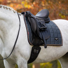 LeMieux Loire Memory Dressage Square Saddle Pad - Petrol Blue, shown on white horse | Malvern Saddlery