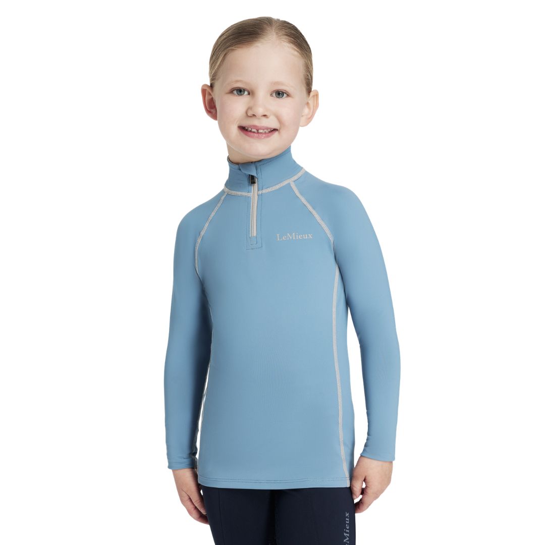 LeMieux Mini Classique Base Layer - Ice Blue; shown on girl against white background | Malvern Saddlery