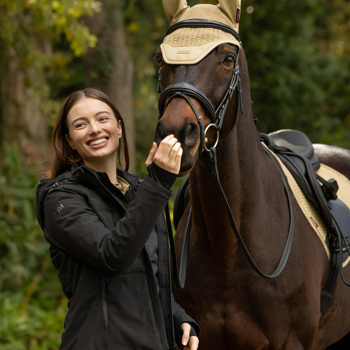 LeMieux Women's Brooke 3-in-1 Waterproof Hybrid Jacket - Black, at the yard with horse | Malvern Saddlery