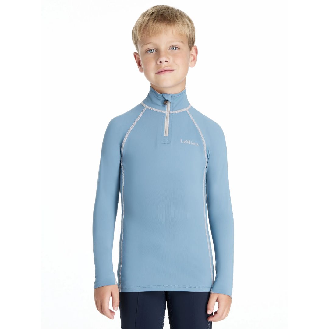 LeMieux Mini Classique Base Layer - Ice Blue; shown on boy against white background | Malvern Saddlery