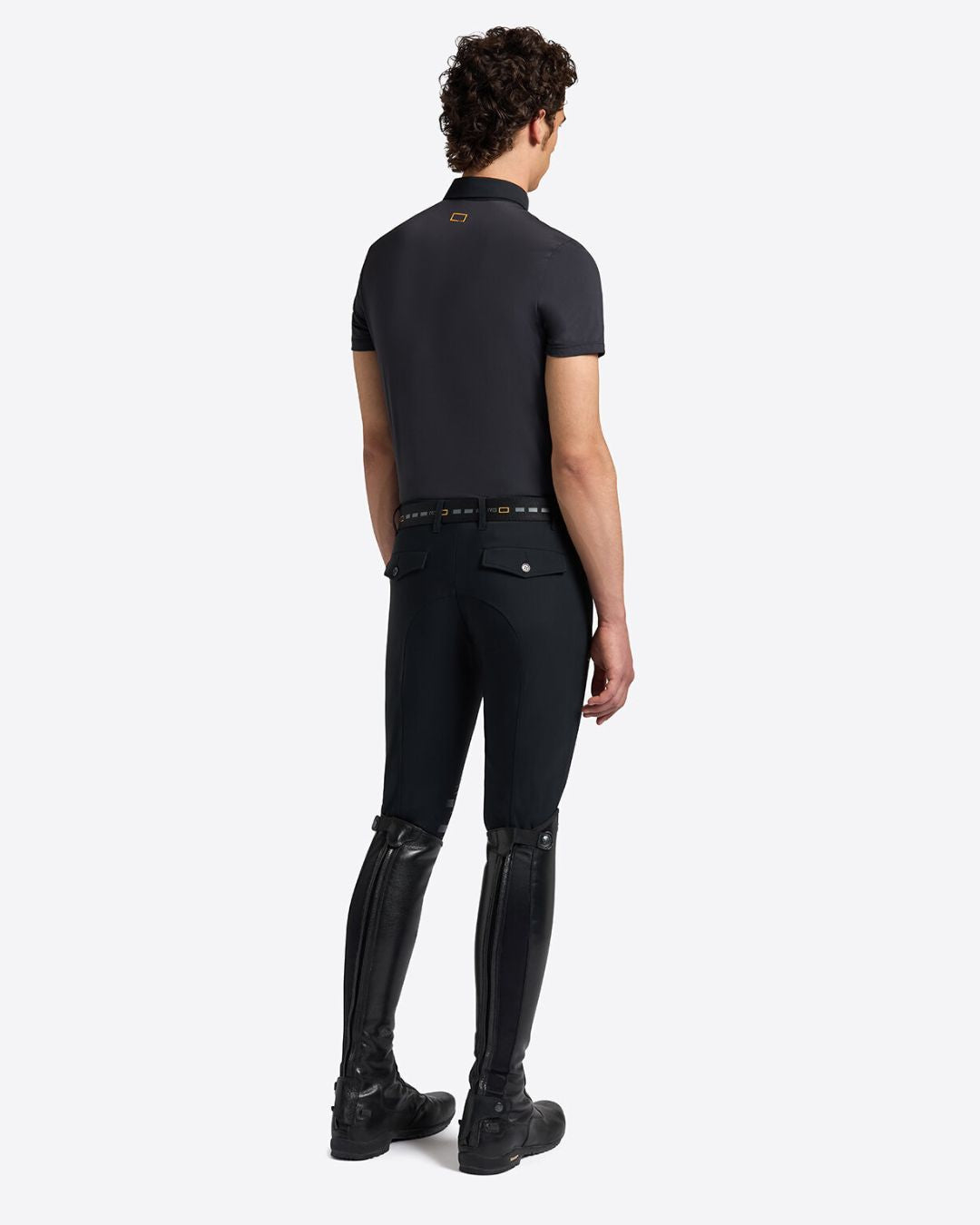 Rider’s Gene Men’s Micro-Perforated Jersey Polo with Button - Navy, on model full body back view | Men's Riding Shirts | Malvern Saddlery