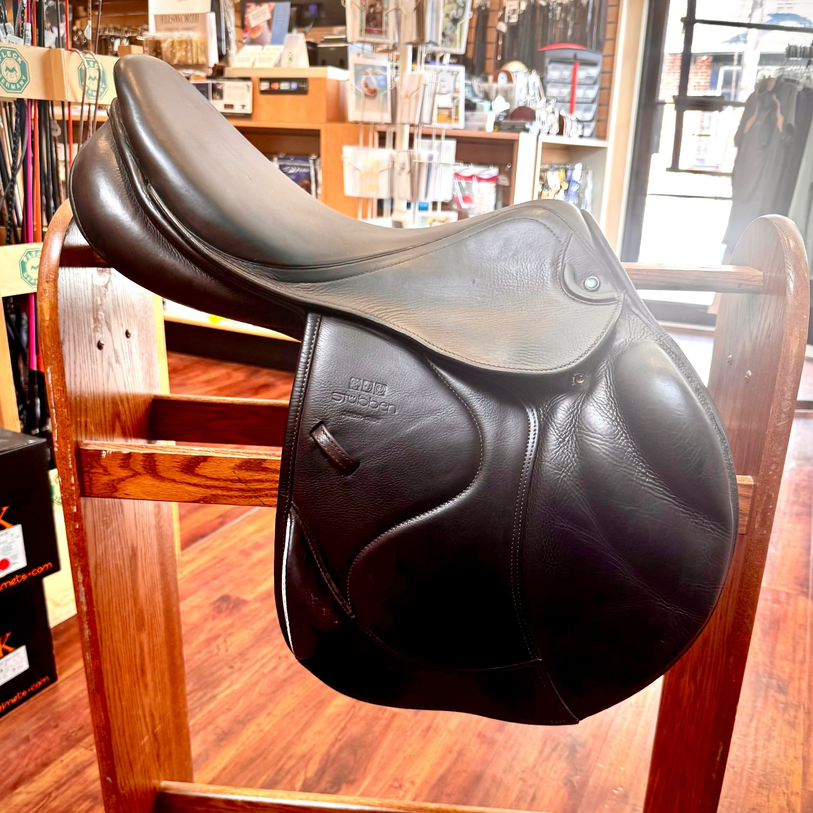Stubben Zaria X Country Jump Consignment Saddle- shown on wooden stand in store | Malvern Saddlery